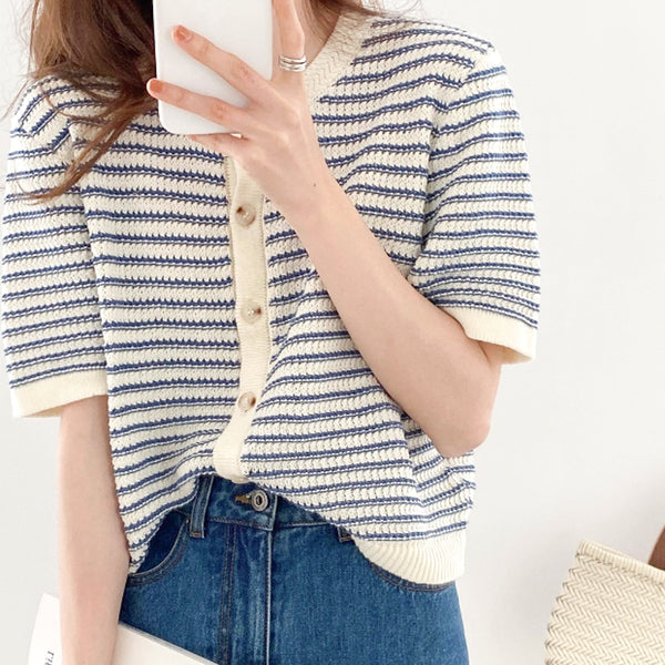 Look cool and stylish with our Striped Knitted Cardigan! This versatile piece can be worn as a cardigan or a top, and its Korean style is sure to make heads turn. Just button it up and you're ready to hit the town in elegance! Blue stripe